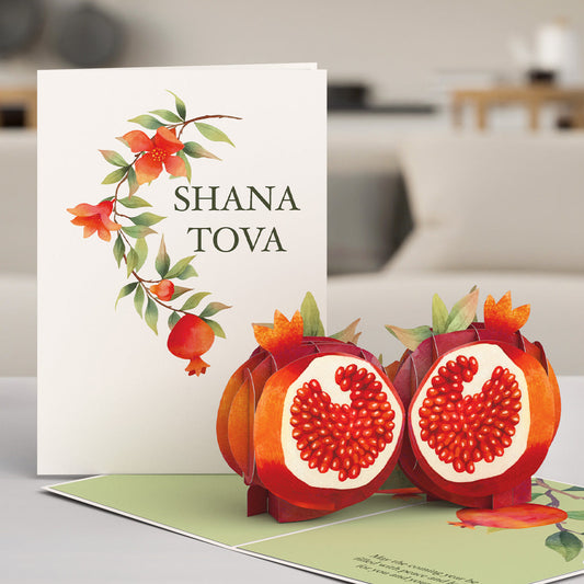 Rosh Hashanah pop-up card featuring pomegranates and a ‘Shana Tova’ greeting for celebrating the Jewish New Year.