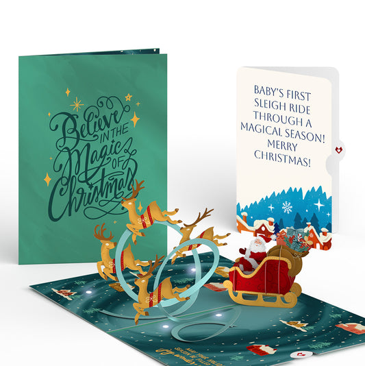Magic of Christmas Santa's Sleigh Light-Up Pop-Up Card and Snow Village Sentiment Set for Baby
